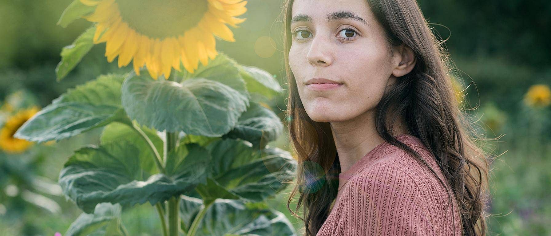 Woman in a field of sunflowers